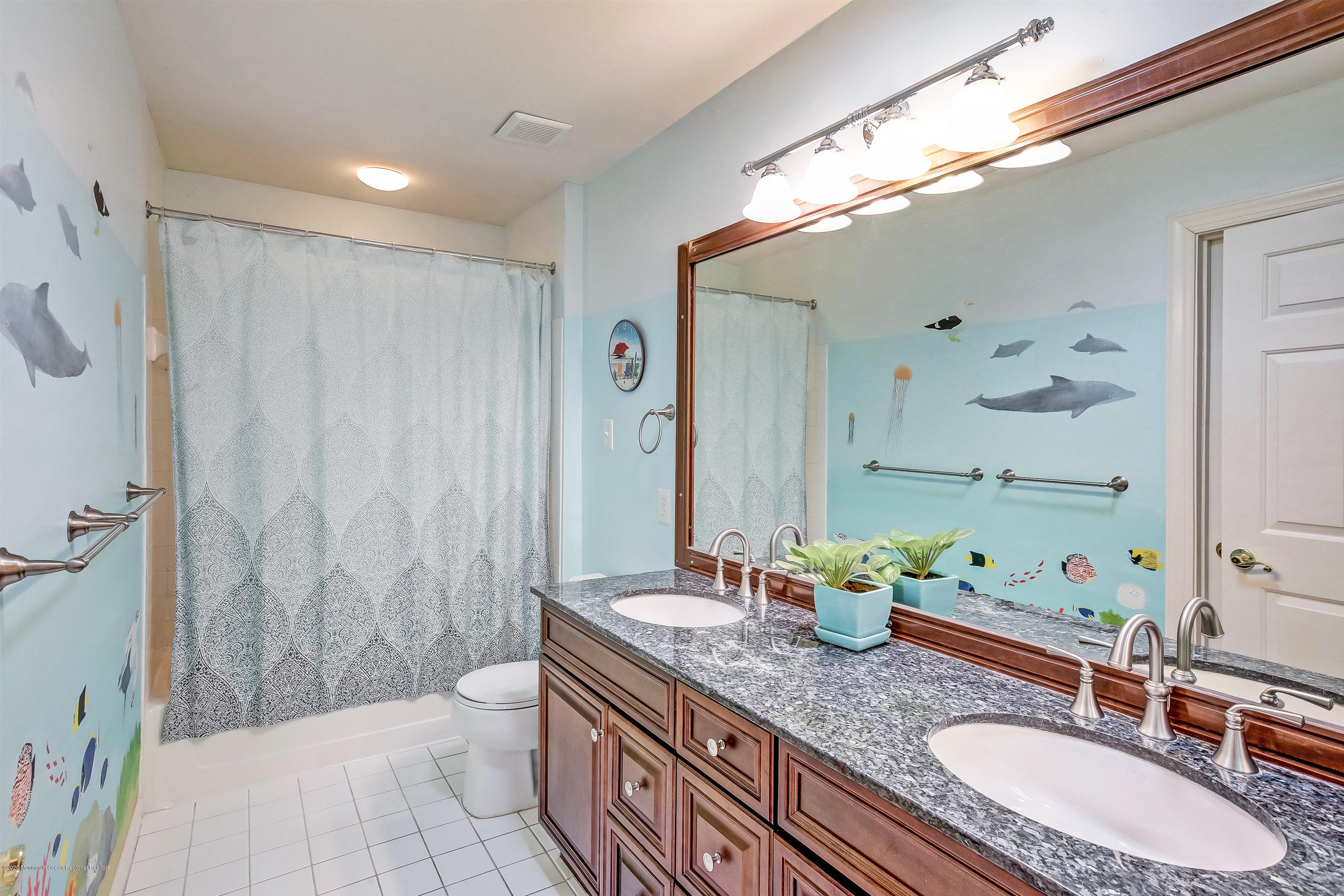 2801 Colonial Drive Wall, NJ 07719 - Photo 33 of 43 a bathroom with a granite countertop sink a toilet and a mirror