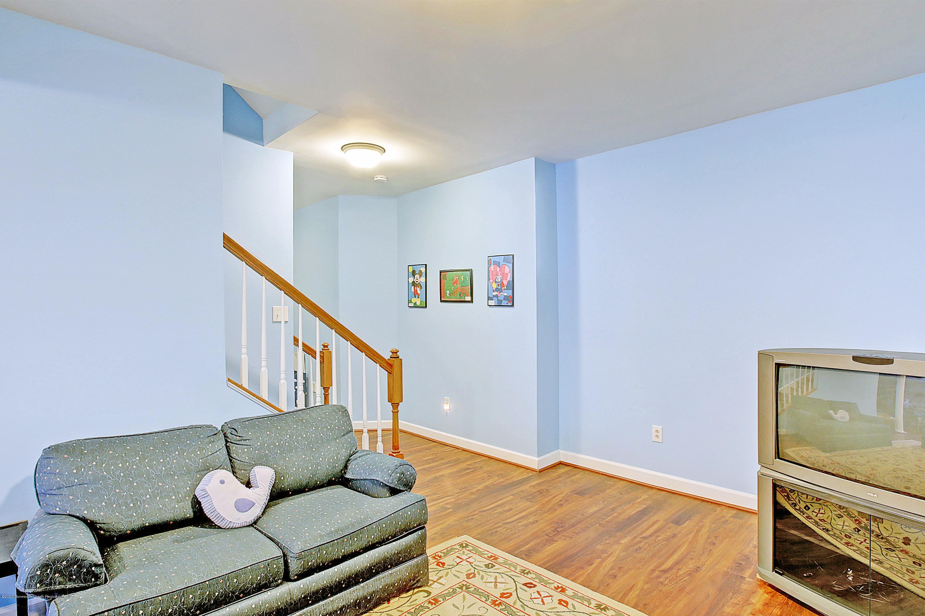2801 Colonial Drive Wall, NJ 07719 - Photo 35 of 43 a living room with furniture and stairs