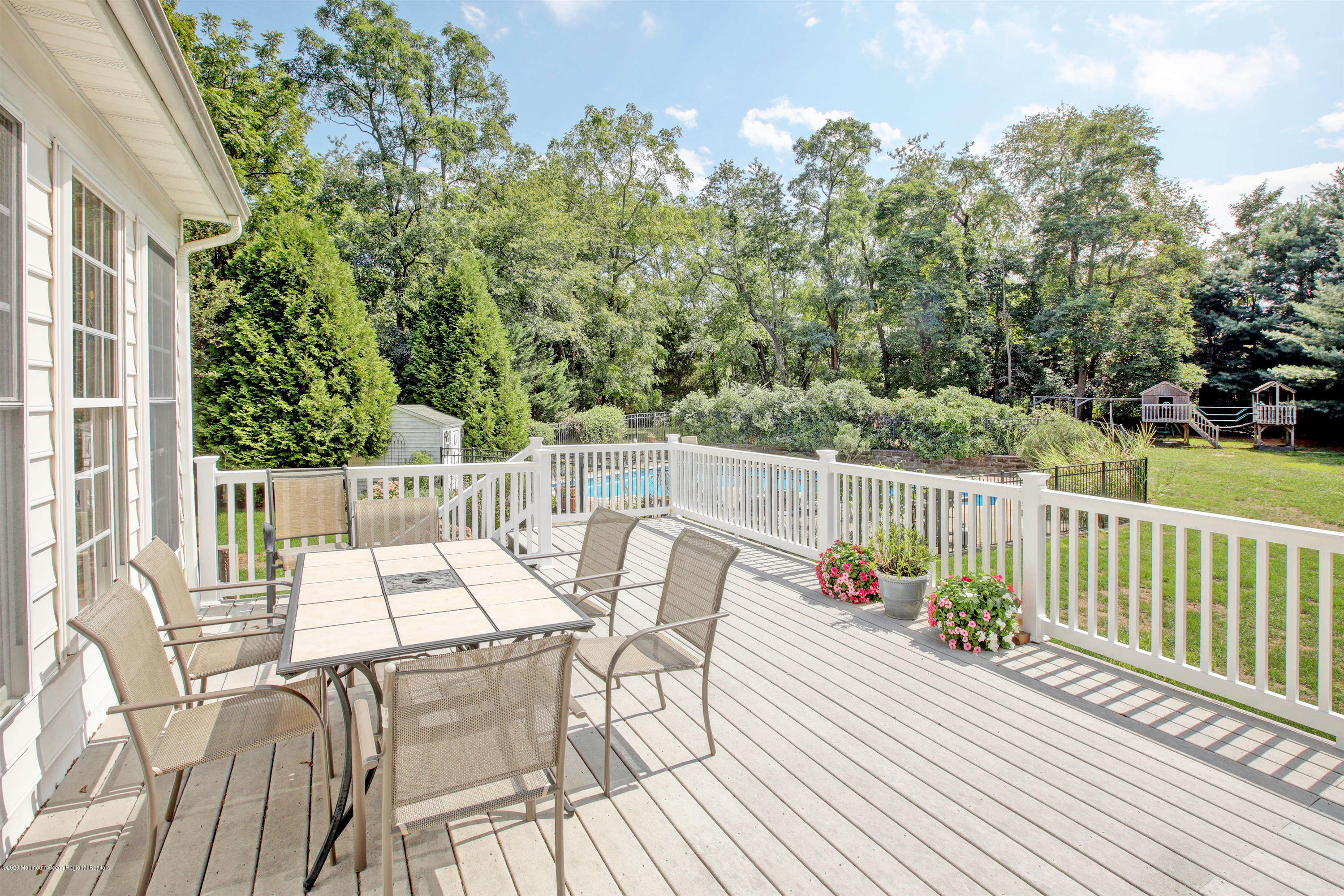 2801 Colonial Drive Wall, NJ 07719 - Photo 36 of 43 a view of a chairs and table on the wooden deck