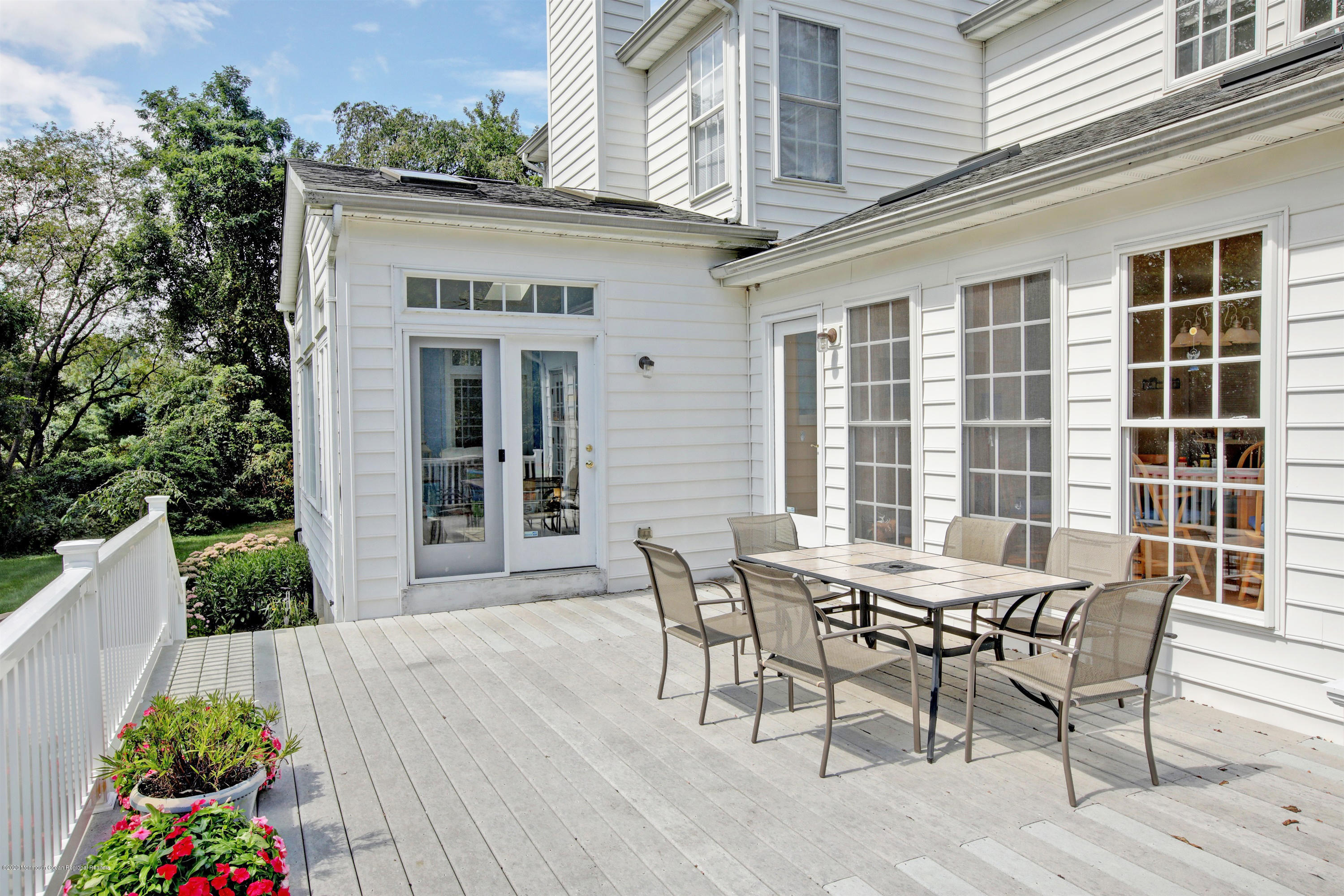 2801 Colonial Drive Wall, NJ 07719 - Photo 37 of 43 a view of a dinning table and chairs in patio of the house