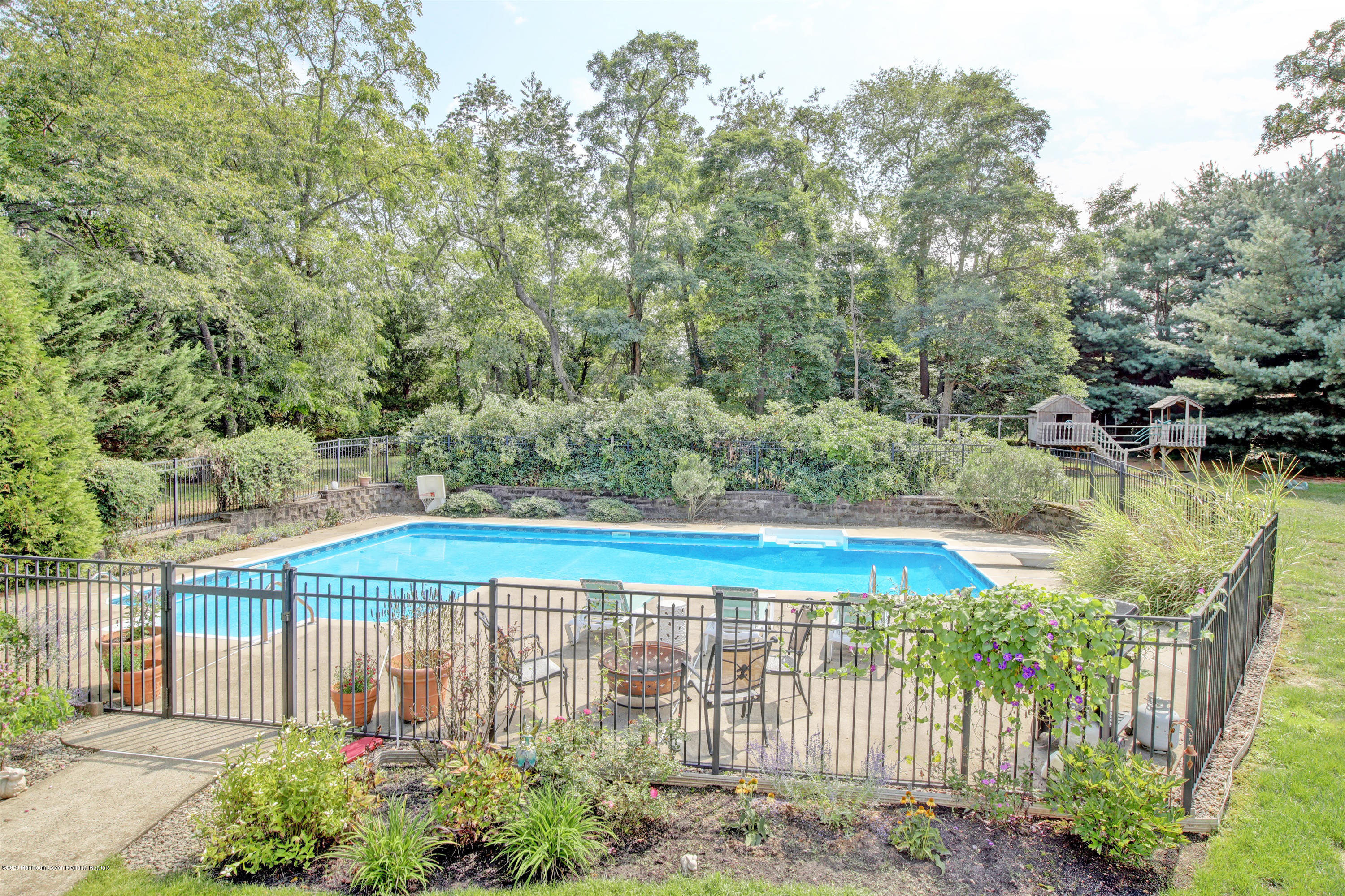 2801 Colonial Drive Wall, NJ 07719 - Photo 38 of 43 a view of a swimming pool with a patio