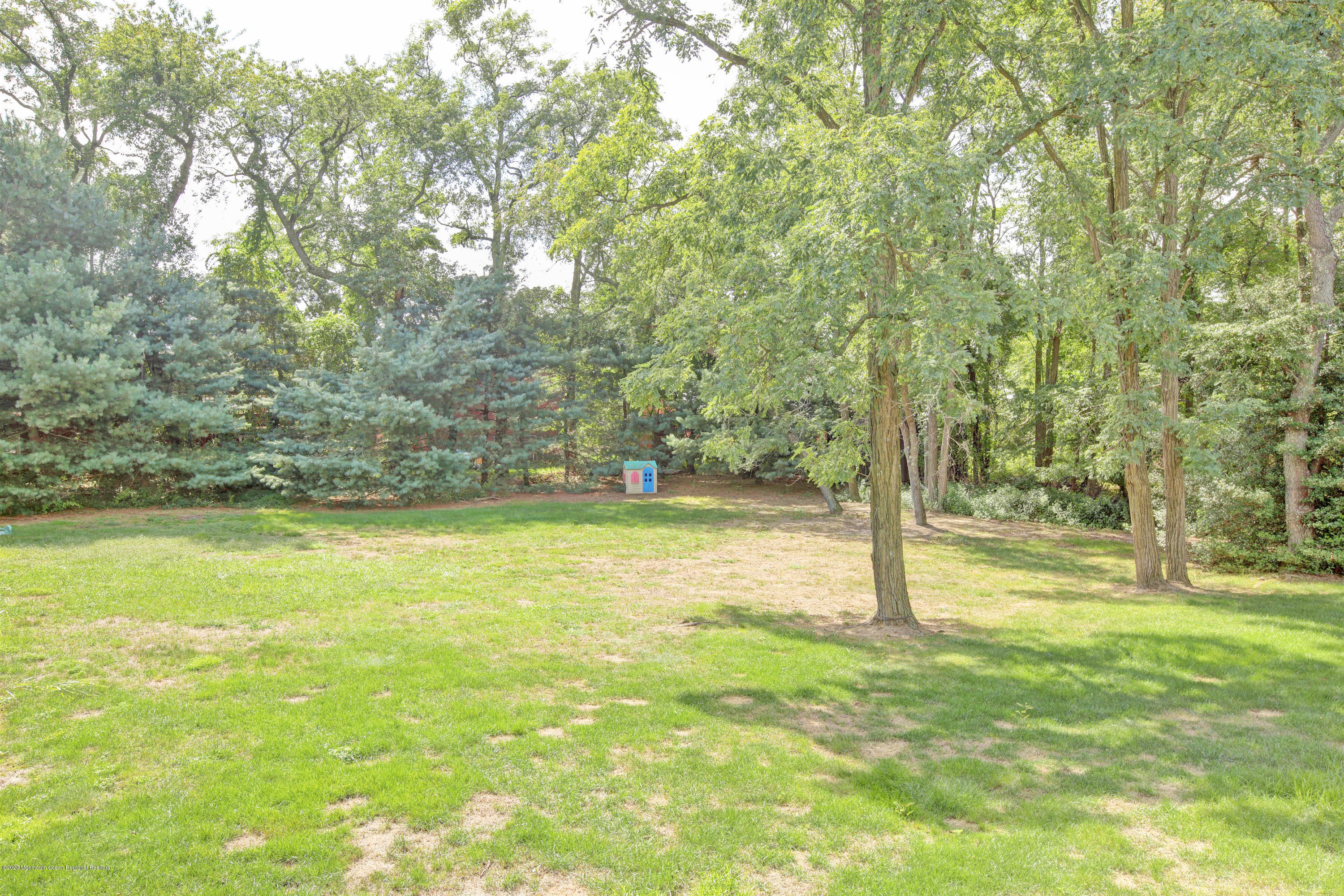 2801 Colonial Drive Wall, NJ 07719 - Photo 42 of 43 a view of a yard with a trees
