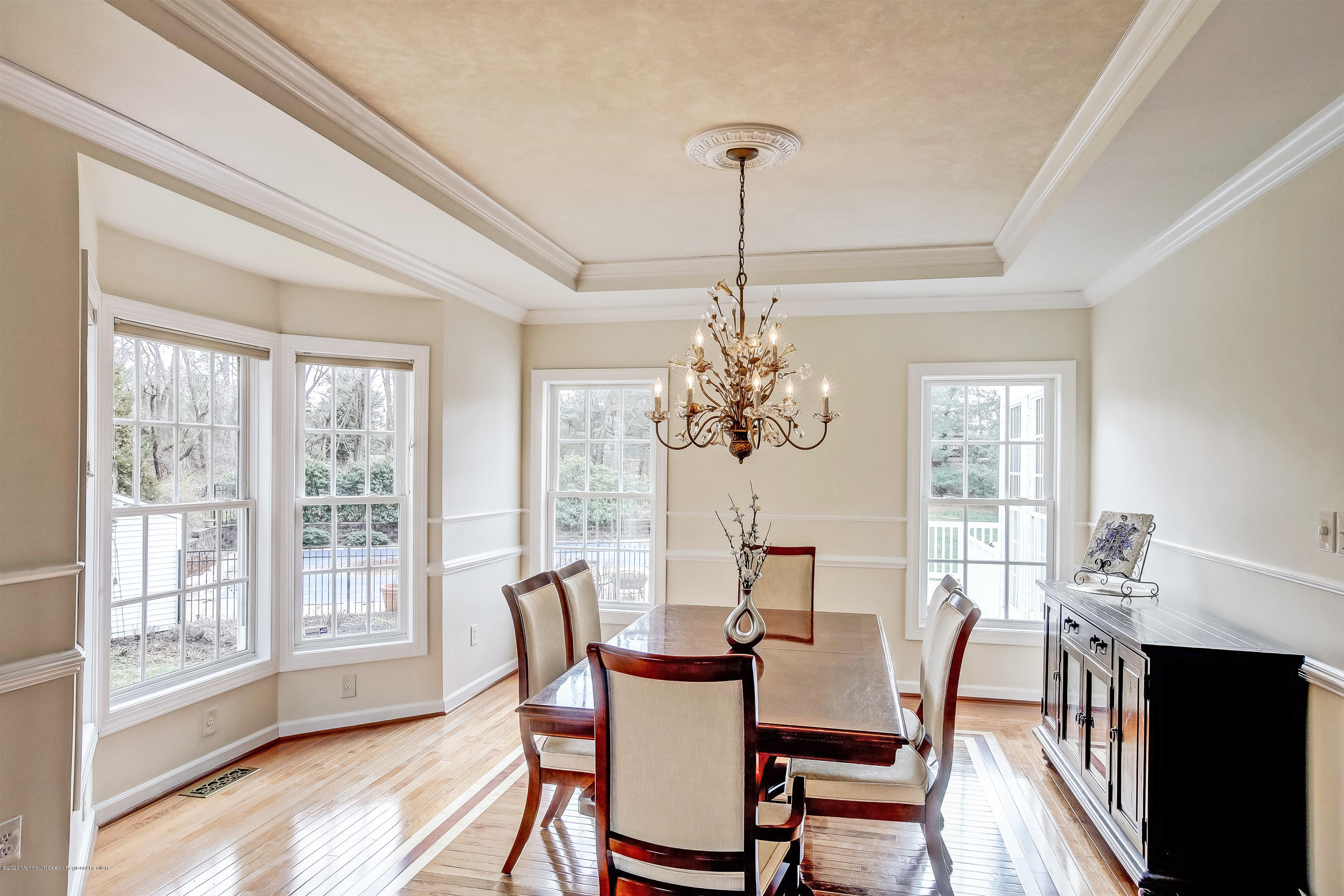 2801 Colonial Drive Wall, NJ 07719 - Photo 7 of 43 a view of a dining room with furniture wooden floor and chandelier