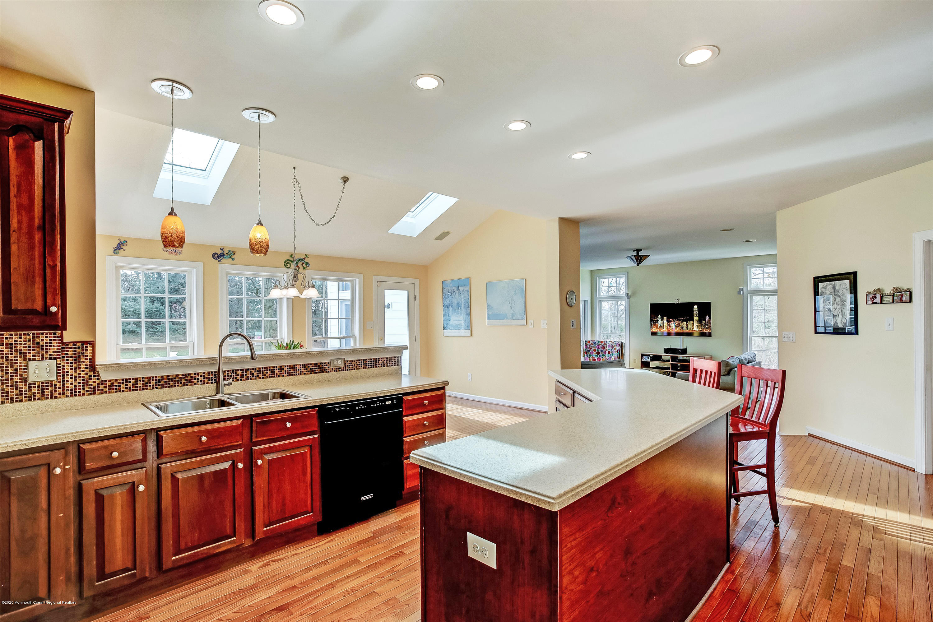 2801 Colonial Drive Wall, NJ 07719 - Photo 9 of 43 a kitchen with granite countertop a sink appliances and wooden floor