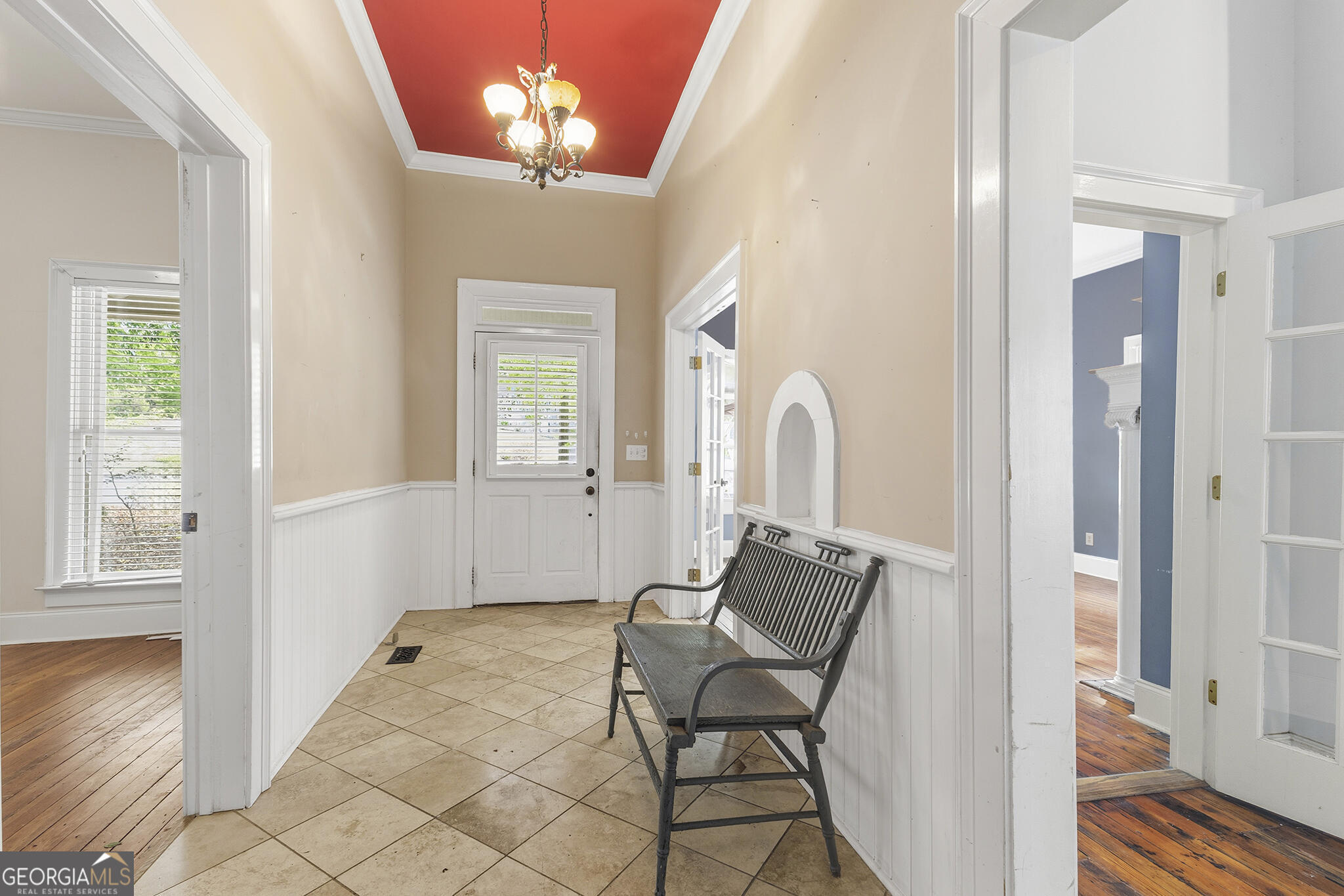 1469 Chestnut Street Macon, GA 31201 - Photo 9 of 26 a view of a hallway with windows and chandelier