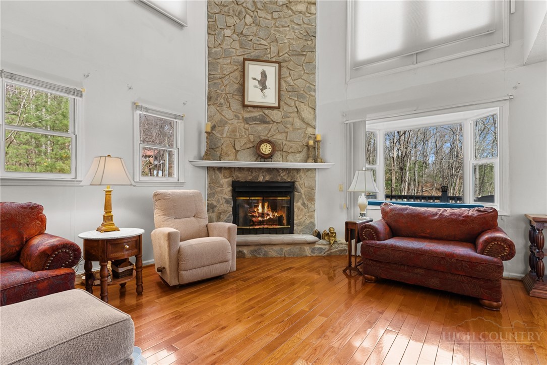 271 Quail Hollow Road Crumpler, NC 28617 - Photo 8 of 30 a living room with furniture and a fireplace