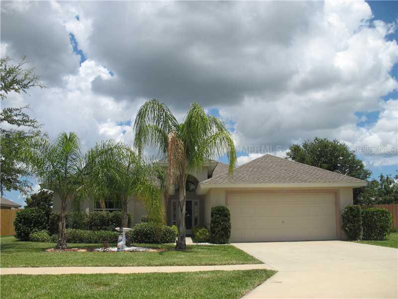 4521 Treasure Cay Road Tavares, FL 32778 - Photo 1 of 1 a front view of a house with a yard