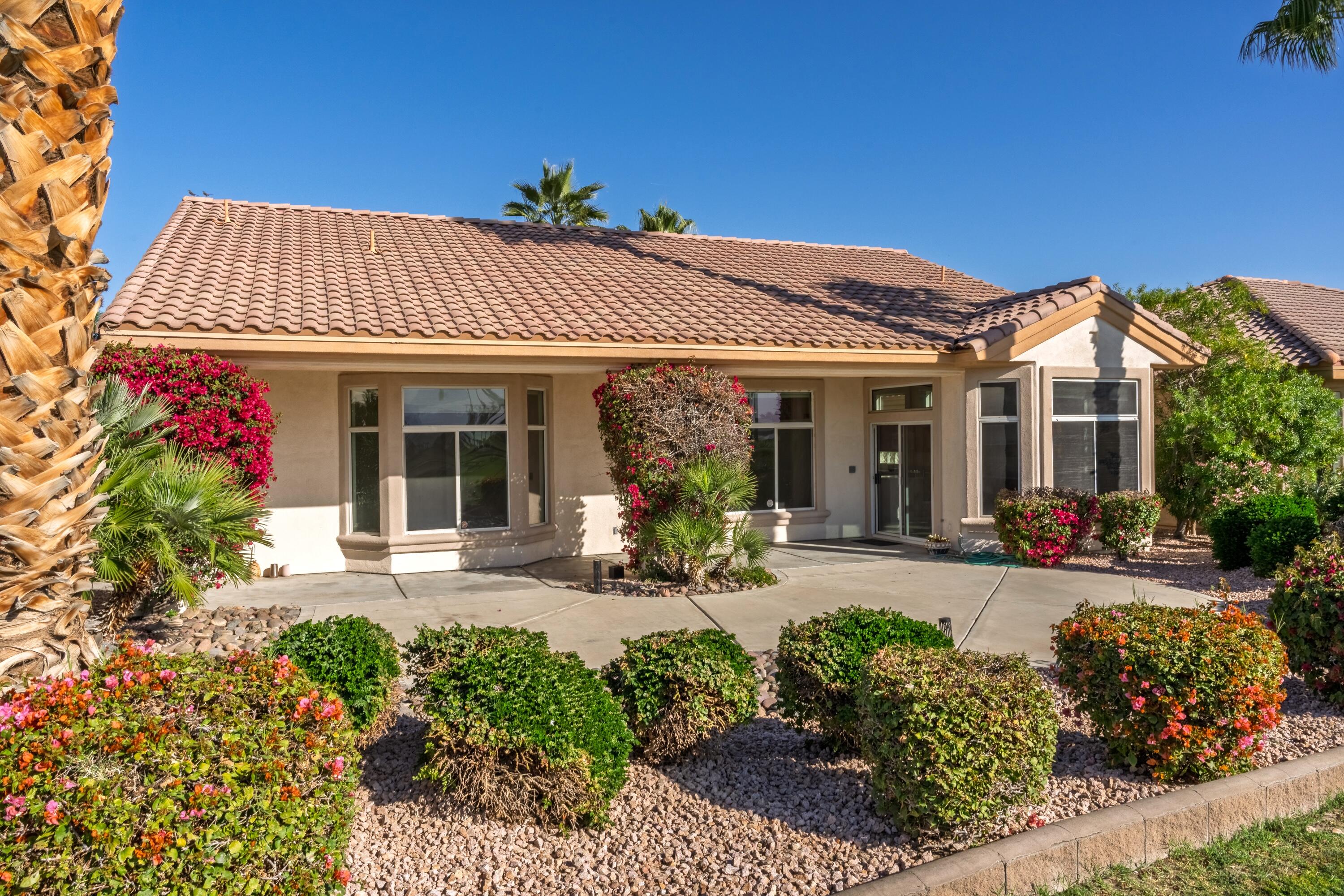 35440 Moorbrook Road Palm Desert, CA 92211 - Photo 29 of 32 front view of a house with a small yard