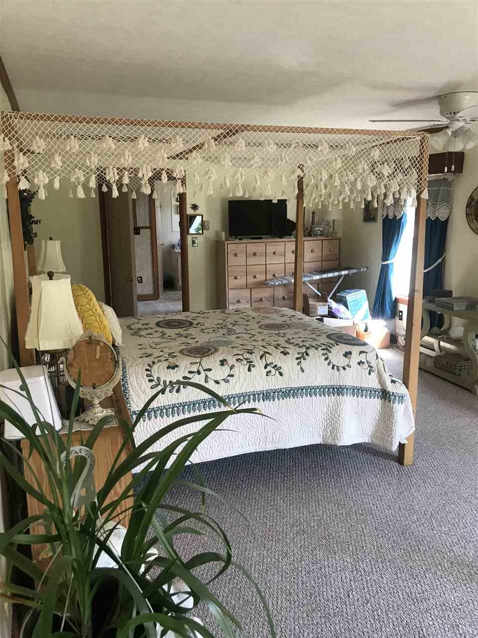7 Coffman Road Weyers Cave, VA 24486 - Photo 4 of 23 a bedroom with a bed and window