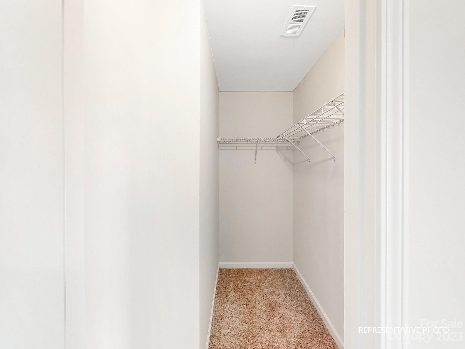 5028 Raspberry Knoll Drive, Unit 1 Charlotte, NC 28208 - Photo 12 of 16 a view of hallway with white walls