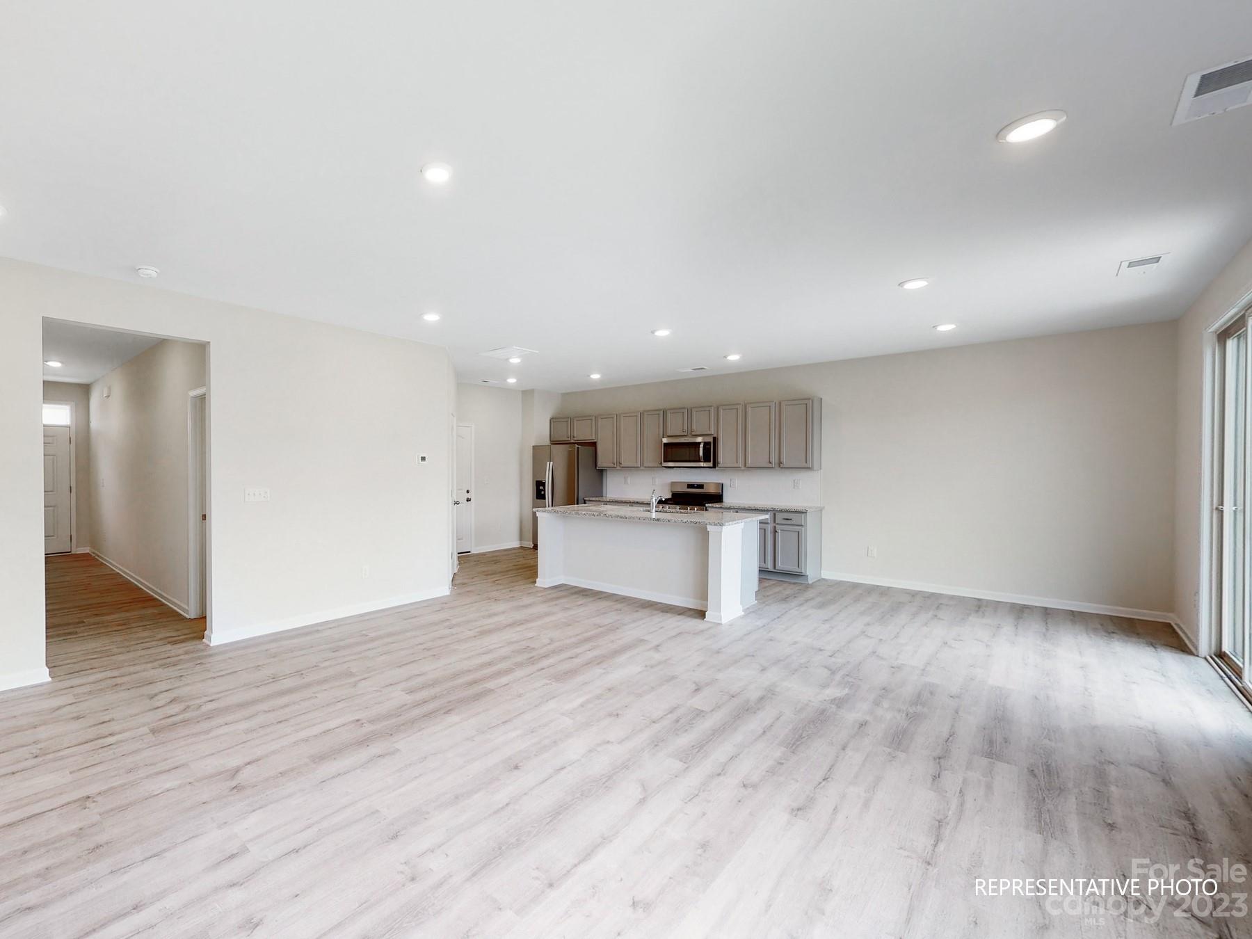 5028 Raspberry Knoll Drive, Unit 1 Charlotte, NC 28208 - Photo 5 of 16 a view of kitchen with wooden floor
