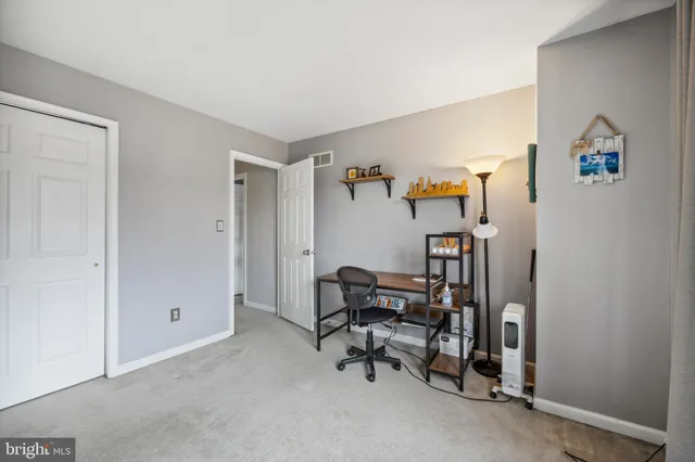 a view of a livingroom with furniture and a window