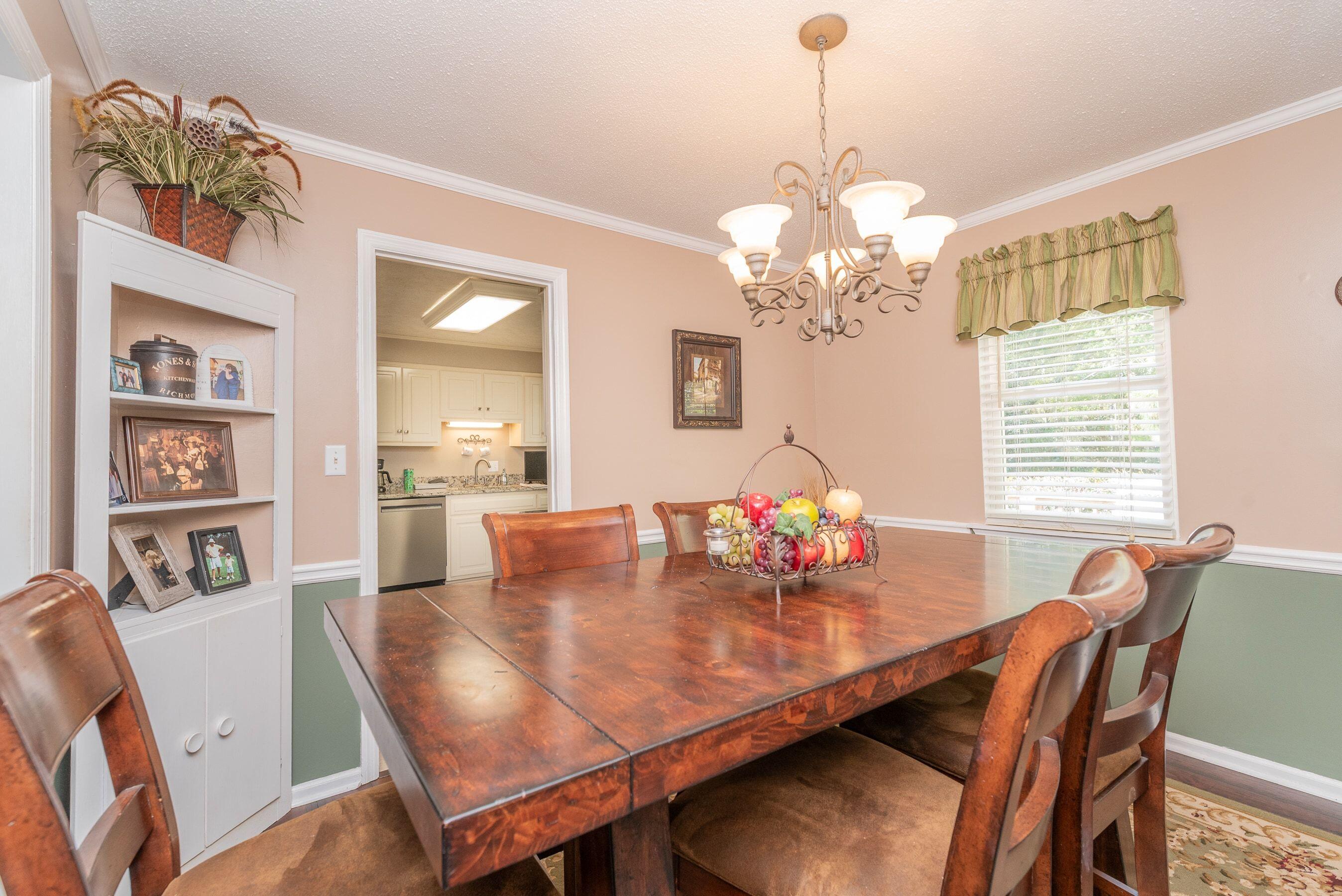 1117 Ridgemont Drive Aiken, SC 29803 - Photo 9 of 49 a view of a dining room with furniture and chandelier