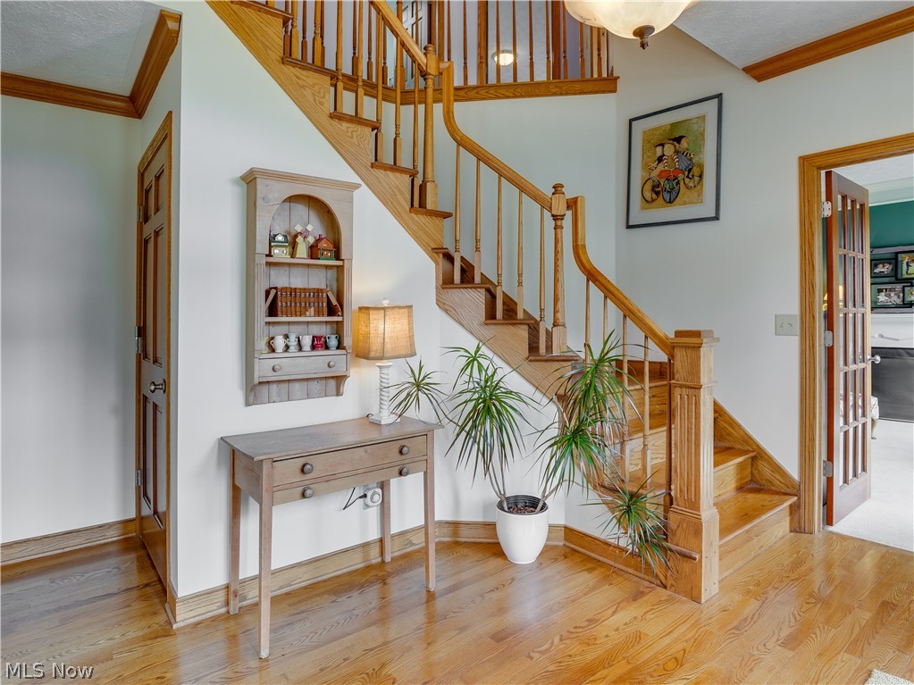 876 Hunter Ridge Circle Fairlawn, OH 44333 - Photo 3 of 35 Beautiful hardwood and an attractive curved stairway greet you upon entering