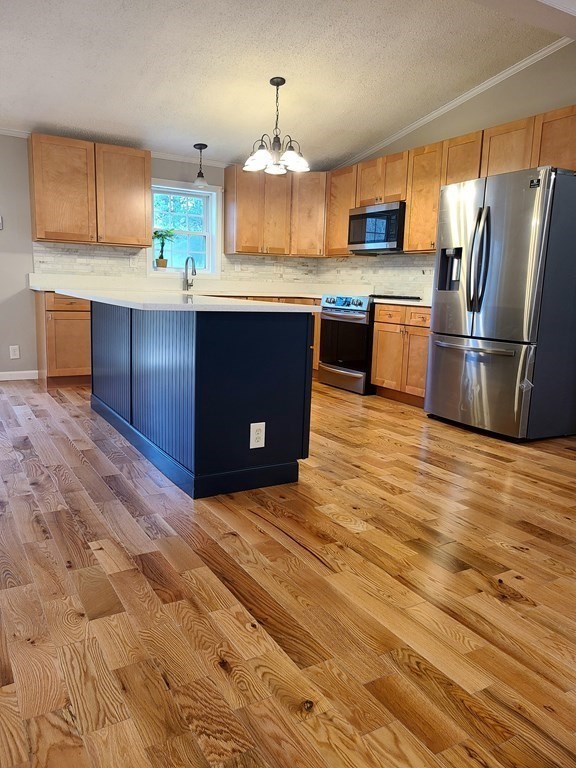 135 Upper Palmer Road Monson, MA 01057 - Photo 4 of 18 a kitchen with stainless steel appliances granite countertop a refrigerator a stove a sink dishwasher and wooden cabinets with wooden floor
