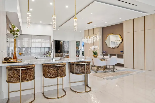 a spacious bedroom with a bed and a chandelier