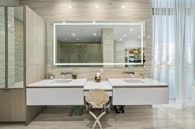 a living room with furniture wooden floor and a large window