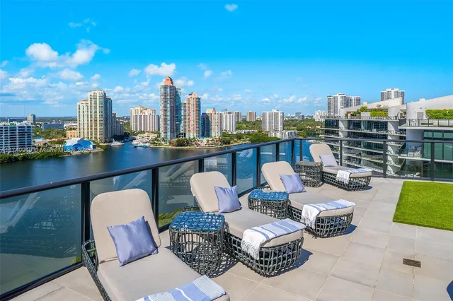 a view of a lake with tall buildings