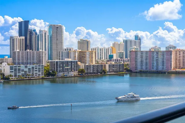 a living room with furniture a large window and a table