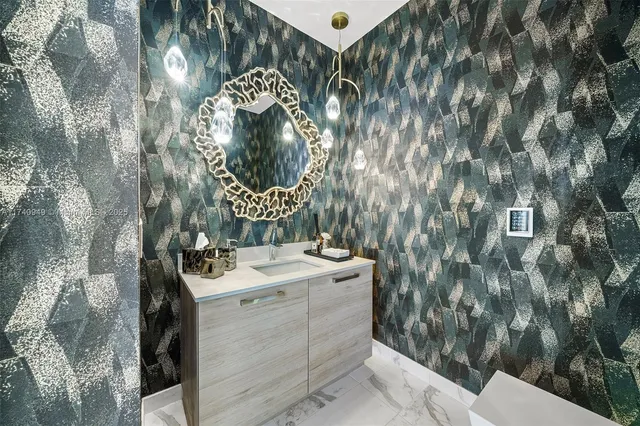 a living room with furniture and a floor to ceiling windows