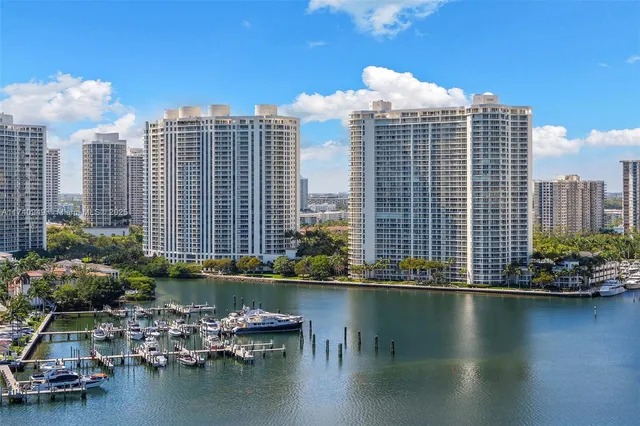 a bed sitting in front of a balcony