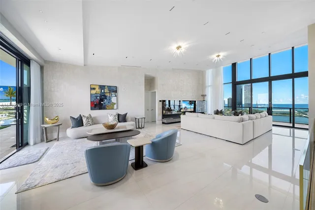 a bathroom with a granite countertop toilet sink and mirror