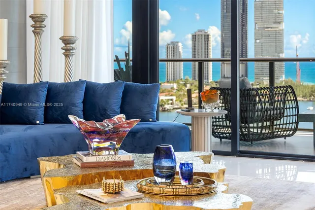 a kitchen with stainless steel appliances kitchen island granite countertop a stove and a refrigerator