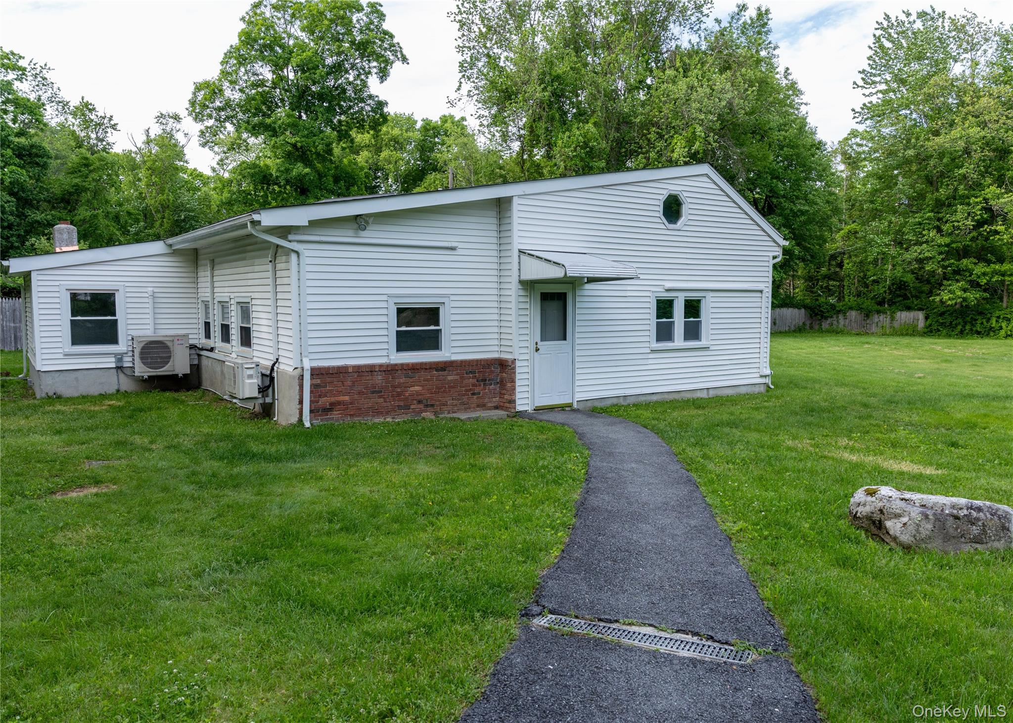 23 Lucille Road Carmel, NY 10512 - Photo 2 of 44 a front view of house with yard and green space