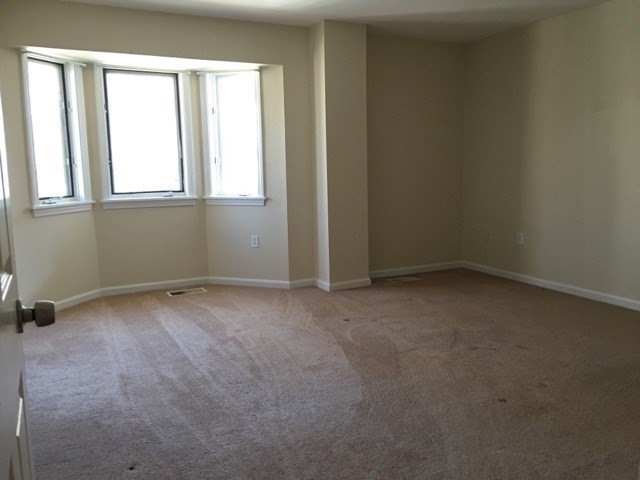 66 St James Street, Unit 209 Boston, MA 02119 - Photo 16 of 20 an empty room with a window