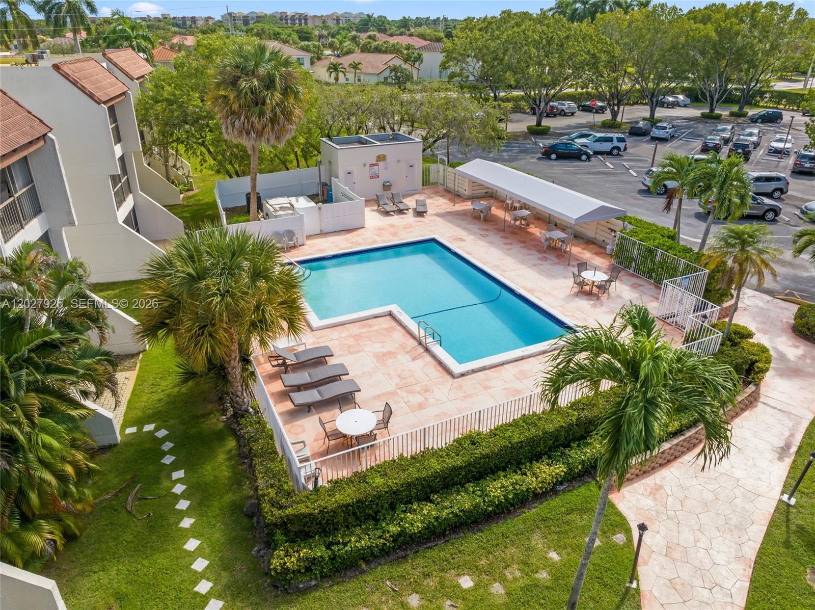 301 Racquet Club Road, Unit 103 Weston, FL 33326 - Photo 14 of 20 an aerial view of a house with a garden and lake view