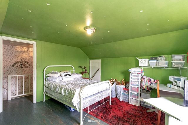 a bedroom with a bed and a table