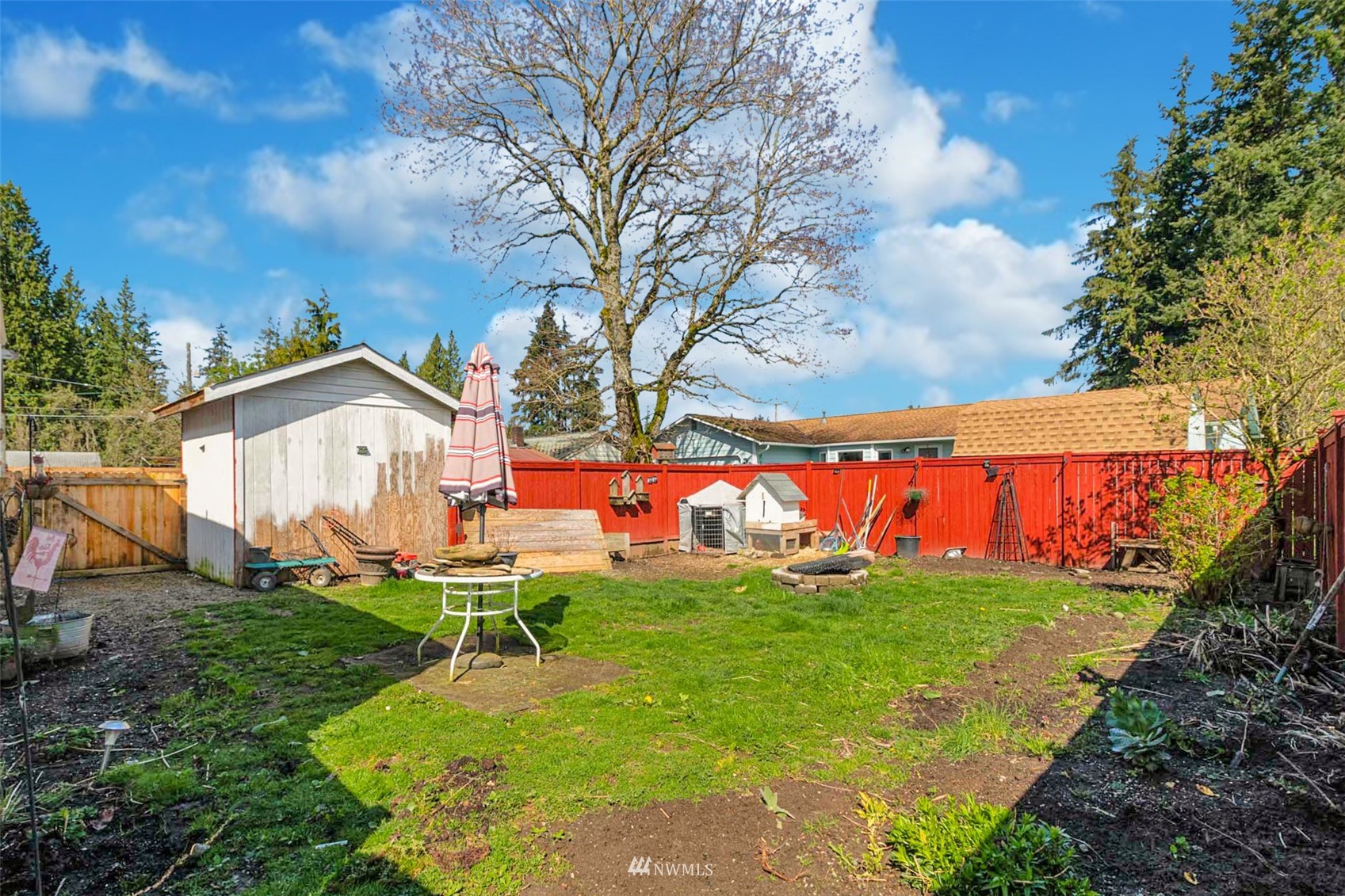 627 Madison Street Everett, WA 98203 - Photo 21 of 23 a view of a house with a yard and sitting area