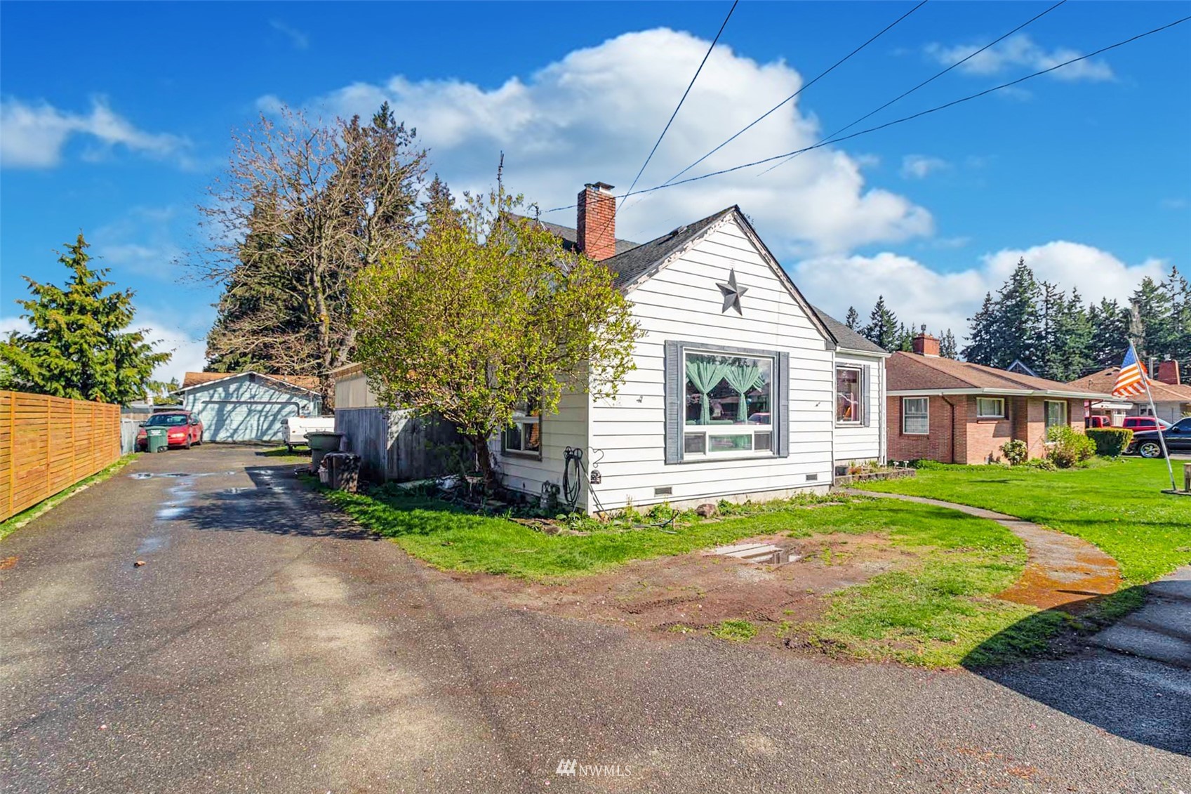 627 Madison Street Everett, WA 98203 - Photo 23 of 23 a front view of a house with a yard and garage