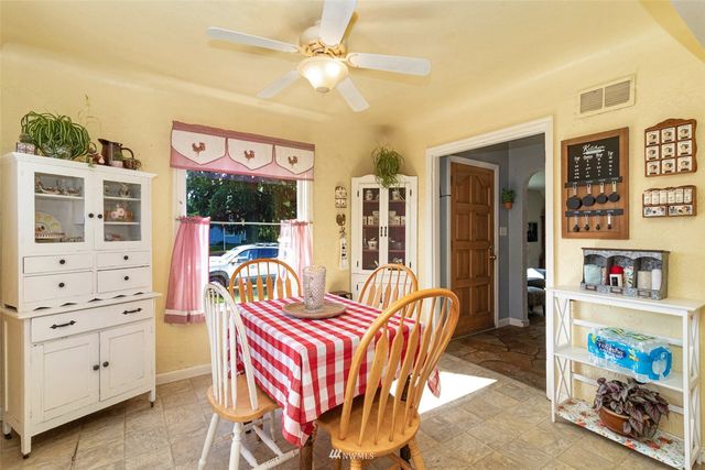 a bedroom with furniture and a baby crib