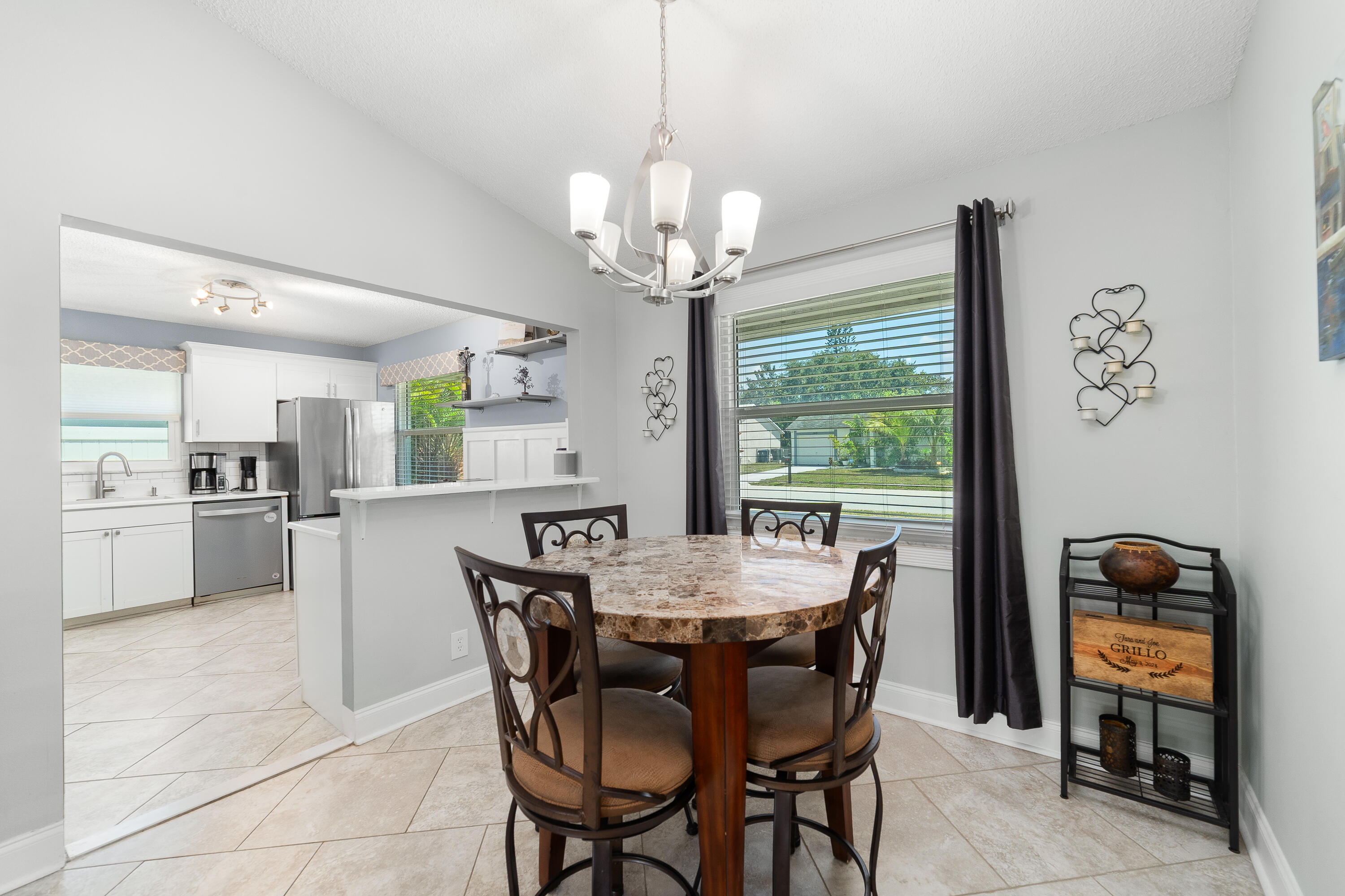 142 Timberline Drive Jupiter, FL 33458 - Photo 11 of 35 a view of a dining room with furniture window and outside view