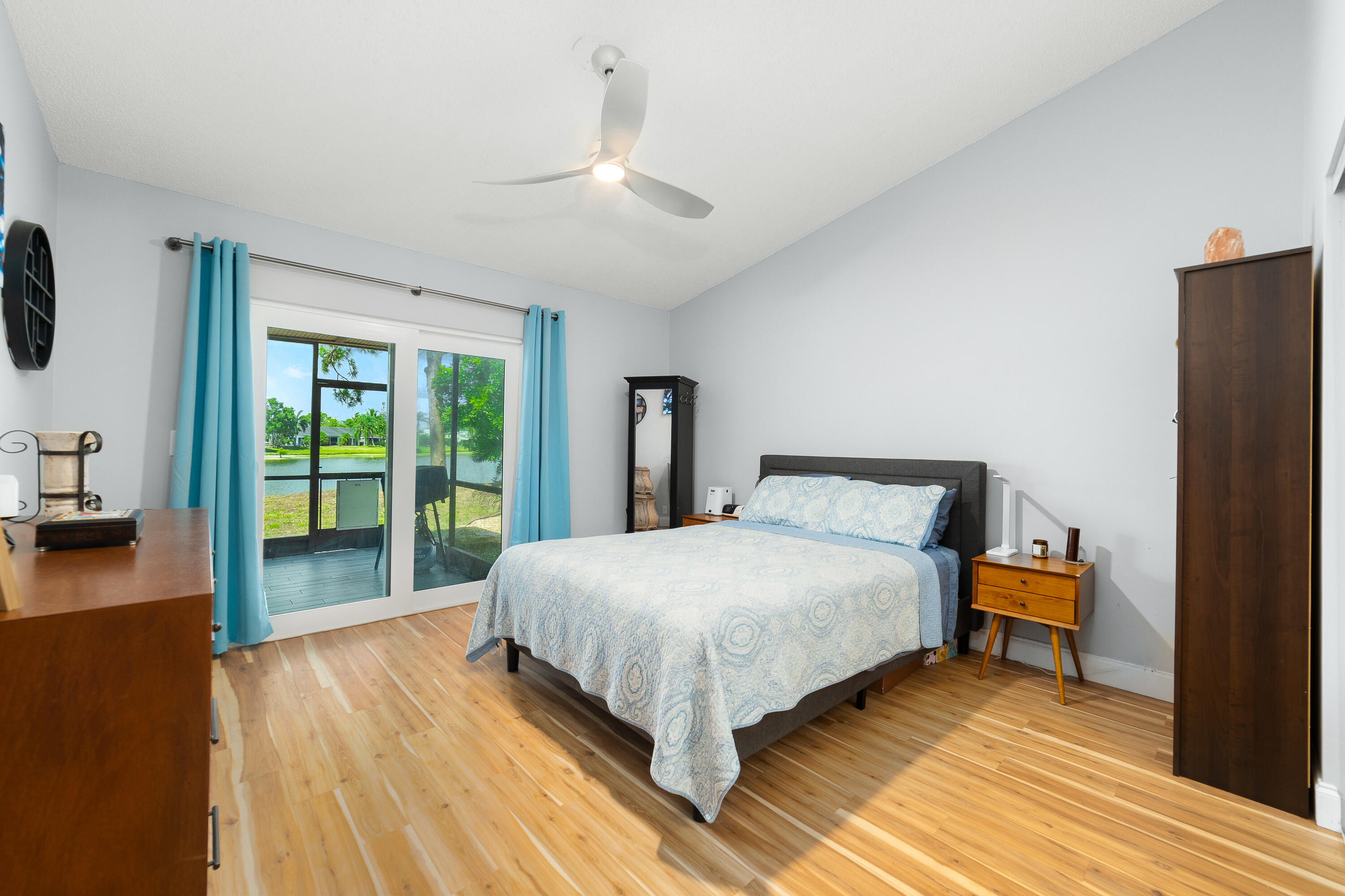 142 Timberline Drive Jupiter, FL 33458 - Photo 18 of 35 a bedroom with a bed and a large window