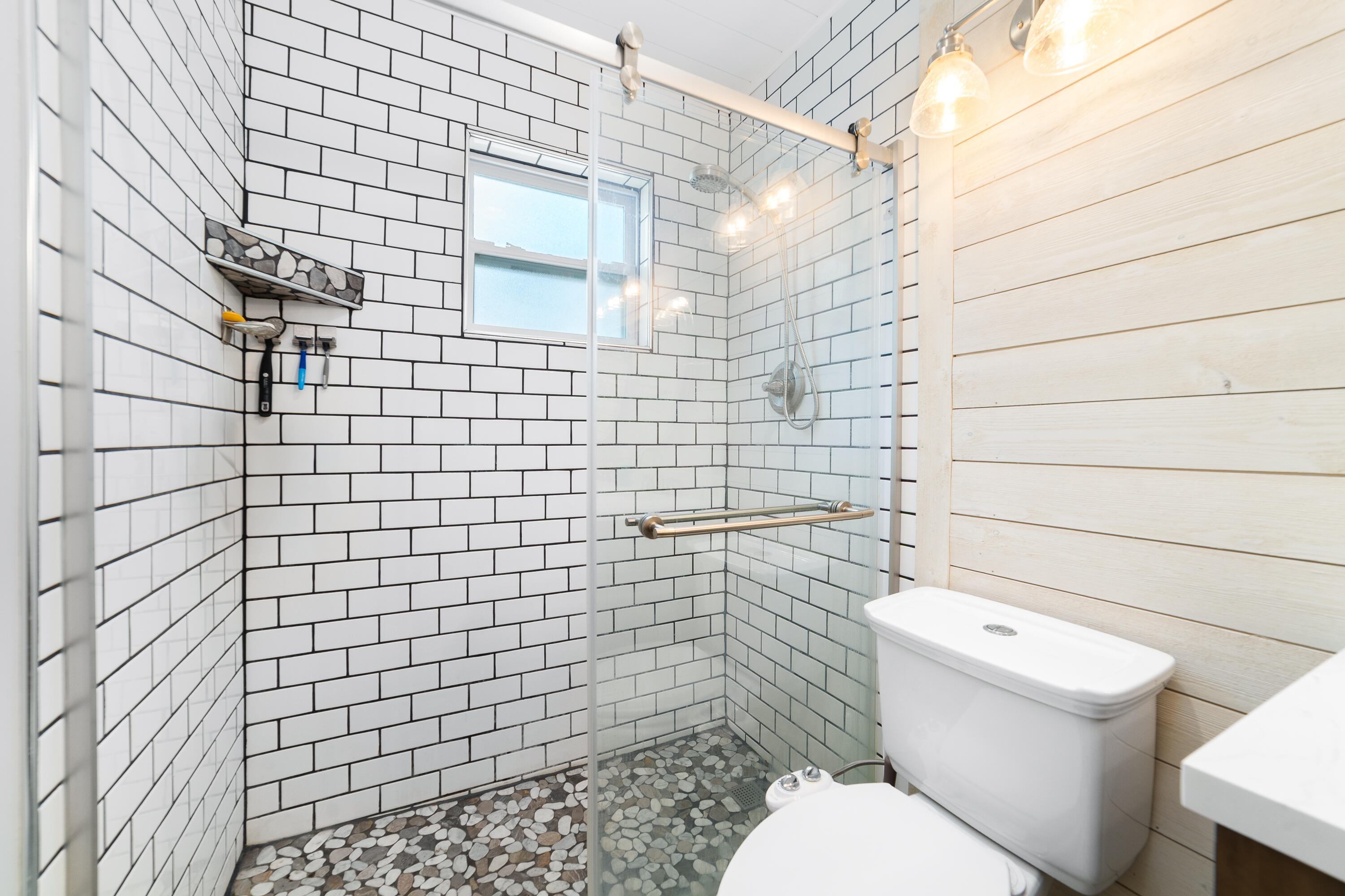 142 Timberline Drive Jupiter, FL 33458 - Photo 21 of 35 a bathroom with a toilet and a shower