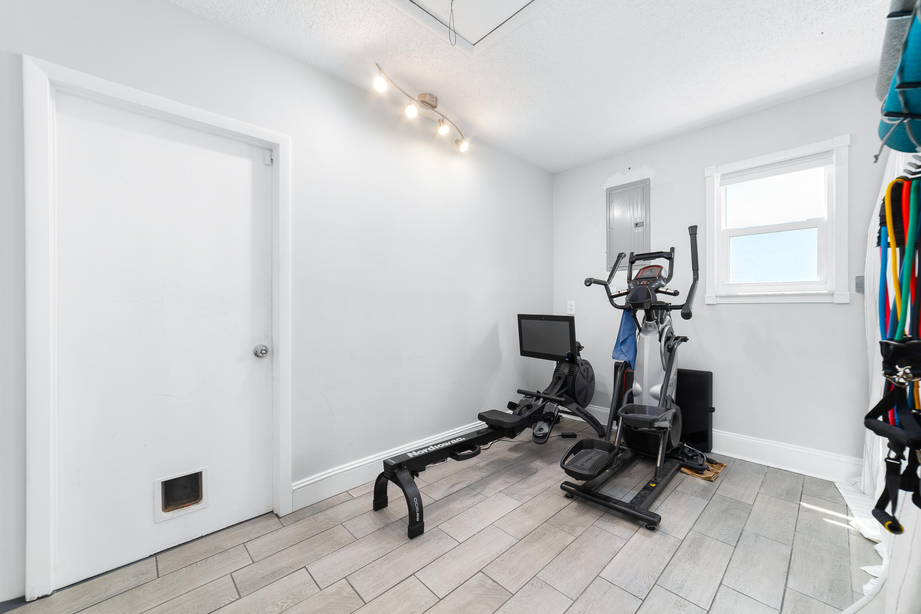 142 Timberline Drive Jupiter, FL 33458 - Photo 25 of 35 a view of a room with gym equipment