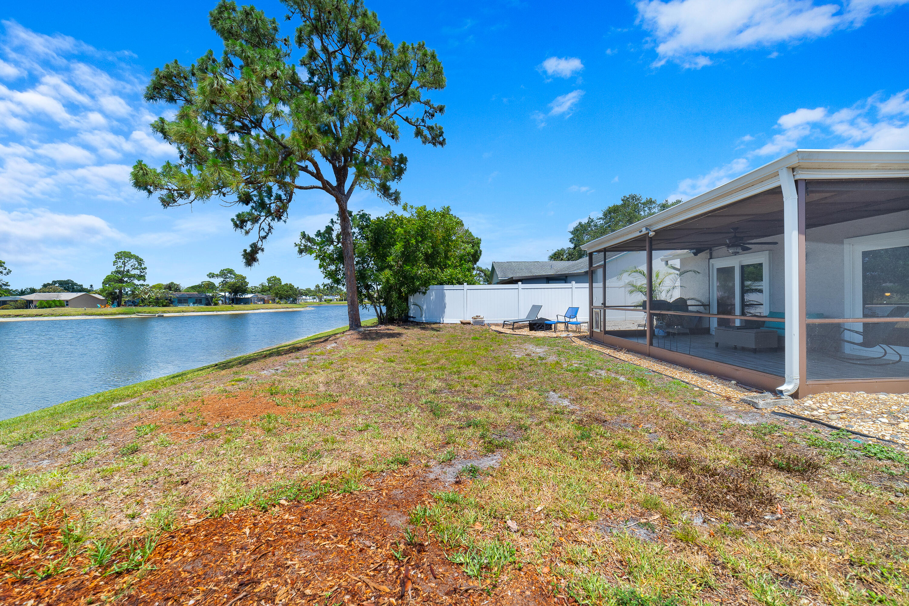 142 Timberline Drive Jupiter, FL 33458 - Photo 31 of 35 a view of a house with a yard and sitting area