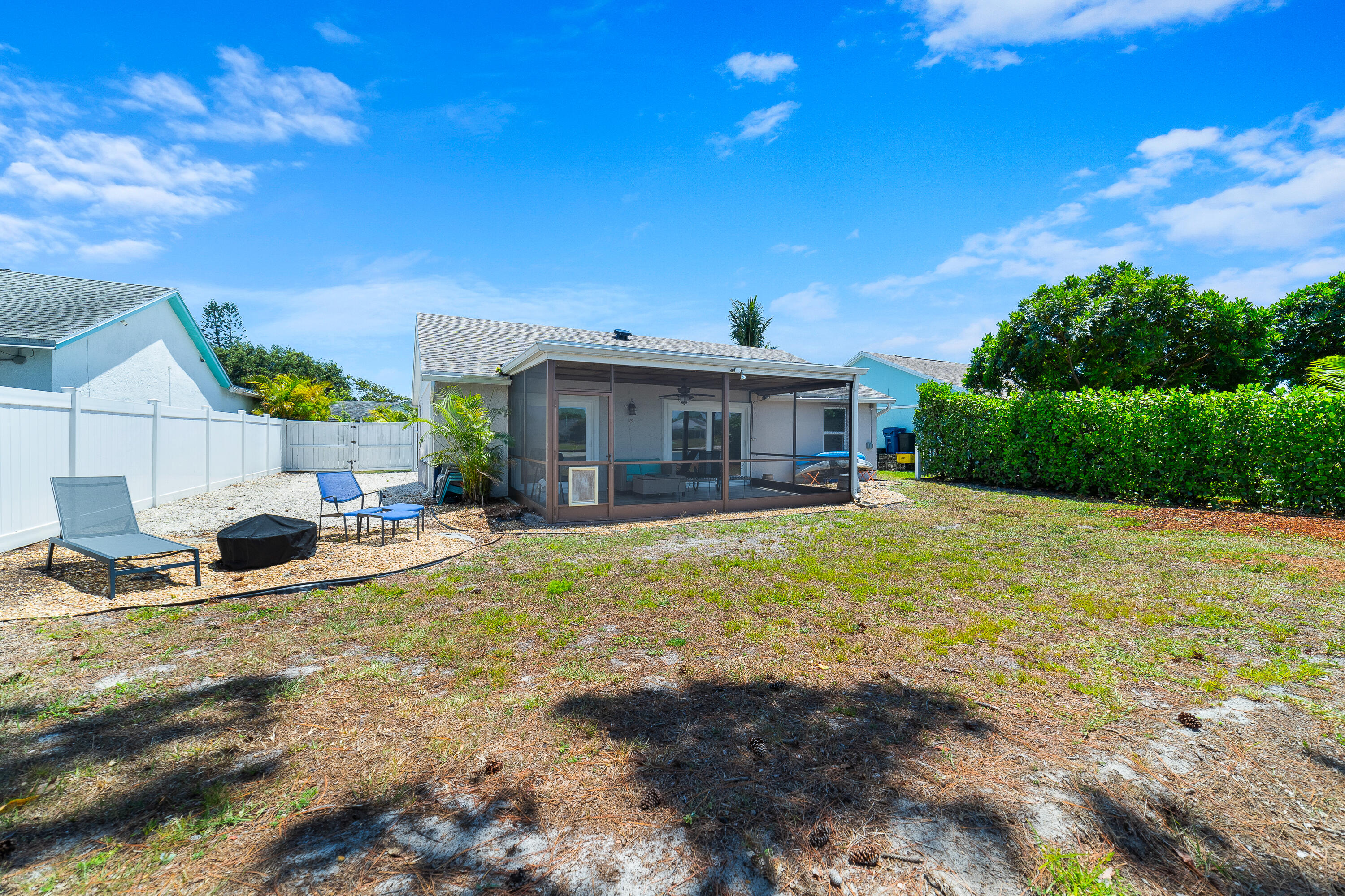 142 Timberline Drive Jupiter, FL 33458 - Photo 32 of 35 a view of a house with swimming pool and sitting area