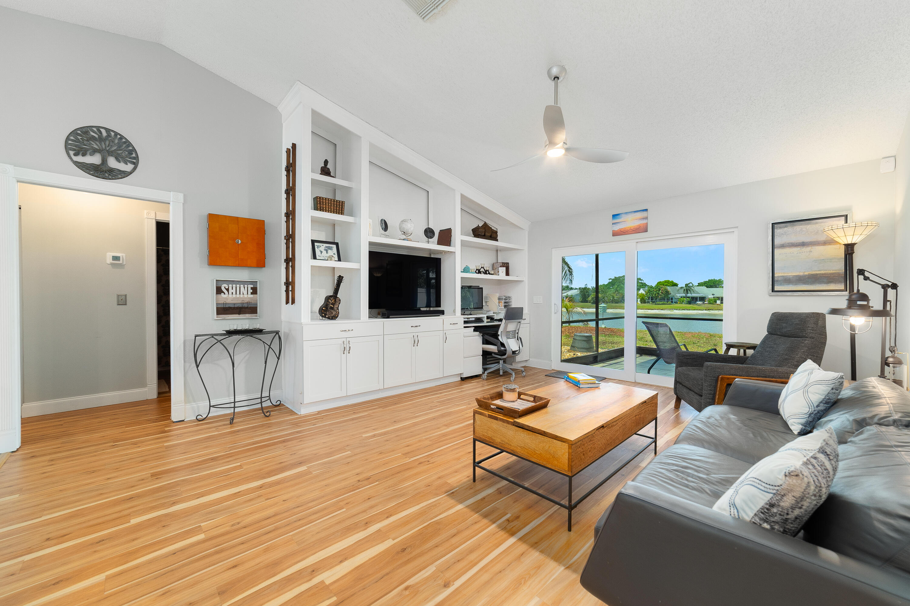 142 Timberline Drive Jupiter, FL 33458 - Photo 5 of 35 a living room with furniture and a flat screen tv