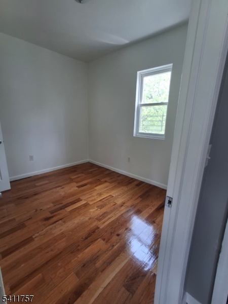904 South 18th Street Newark, NJ 07108 - Photo 11 of 11 a view of empty room with wooden floor