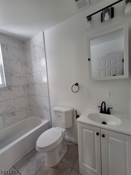 904 South 18th Street Newark, NJ 07108 - Photo 3 of 11 a bathroom with a sink a toilet and shower