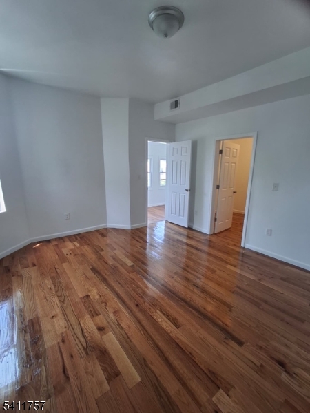 904 South 18th Street Newark, NJ 07108 - Photo 5 of 11 wooden floor in an empty room