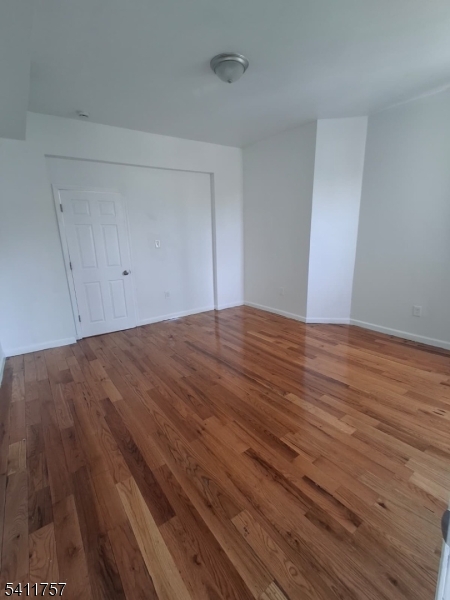 904 South 18th Street Newark, NJ 07108 - Photo 6 of 11 a view of empty room with wooden floor