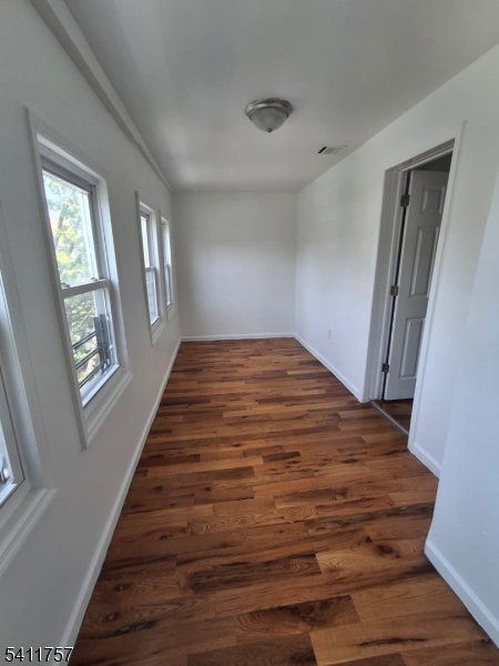 904 South 18th Street Newark, NJ 07108 - Photo 7 of 11 a view of a room with wooden floor and window