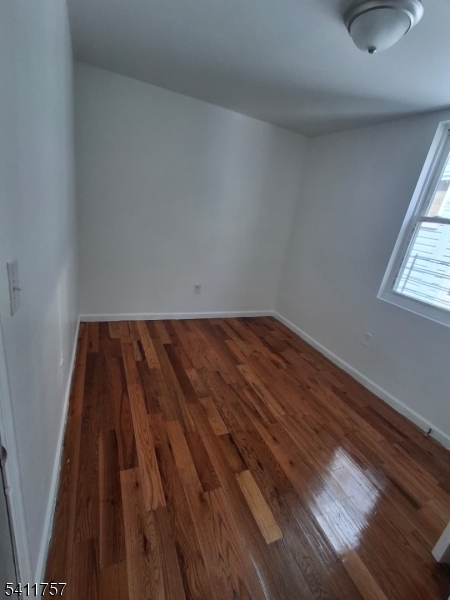 904 South 18th Street Newark, NJ 07108 - Photo 10 of 11 a view of wooden floor in a room