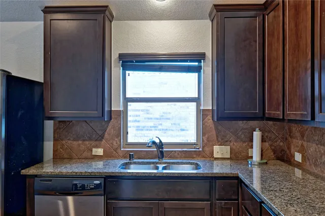 a view of a room with wooden floor and bathroom