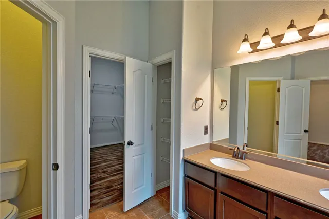 a front view of a house with a yard fountain and a fountain