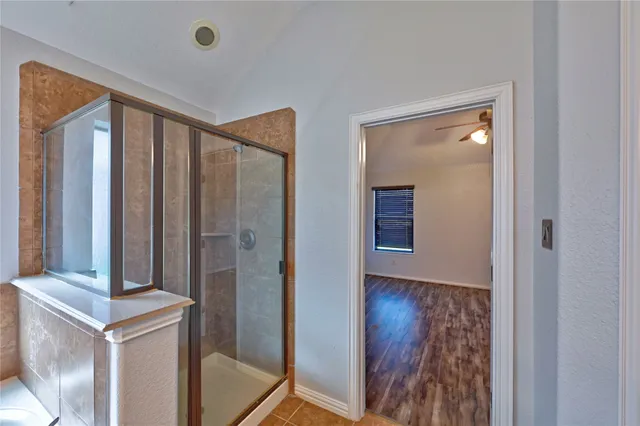 a view of a house with a door and wooden walls